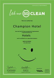 a green invitation with a smiley face at Champion Hotel in Singapore