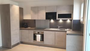Kuchyň nebo kuchyňský kout v ubytování Appartement IRE