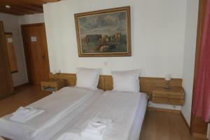 Voodi või voodid majutusasutuse Hotel Franziskaner toas
