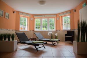a waiting room with two chairs and windows at Villa Ingeborg in Fürstenberg
