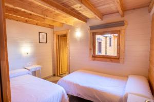 Łóżko lub łóżka w pokoju w obiekcie Villas de Arribes