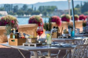 a table that has some food on it at Grand Hotel Gardone in Gardone Riviera