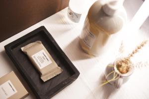 a bottle of milk sitting on a table next to a container at Arya Nobile Dimora in Carovigno
