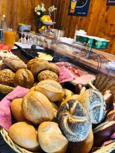 a bunch of breads and pastries on a table at Hotel Altstadt Wöllbacher Tor in Wetzlar