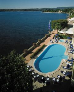 a view from a balcony of a large body of water at Grand Hotel Gardone in Gardone Riviera