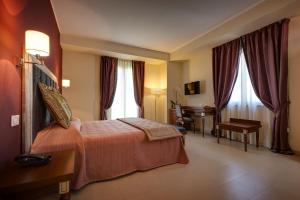 Postel nebo postele na pokoji v ubytování Hotel Parco delle Fontane