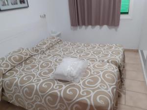 Postel nebo postele na pokoji v ubytování Niza Apartamentos