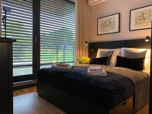Postel nebo postele na pokoji v ubytování Apartament Krzysztofa Bochusa
