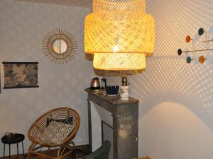 a lamp sitting on a table in a room at Villa Colombier in Pontgibaud