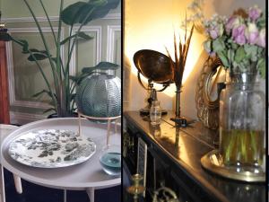 a table with a plate and a vase with flowers on it at Villa Colombier in Pontgibaud