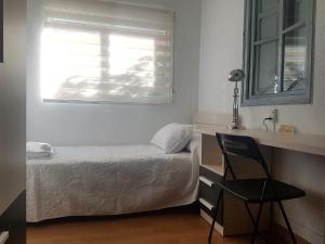 Кровать или кровати в номере Apartamento con vistas a la Marina Real