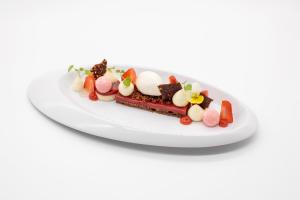 a plate of food on a white plate at Gourmet Hotel Zur Post in Saint-Vith