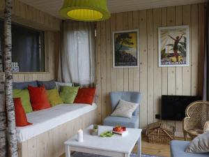 a bedroom with a bed with colorful pillows at Gite Basse Correo in La Freissinouse +9 photos