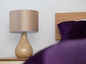 Ένα ή περισσότερα κρεβάτια σε δωμάτιο στο Luxurious Serviced Apartments
