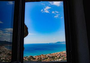 a view of the ocean from a window at Blu Oltremare in Borgio Verezzi