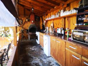 a kitchen with a long counter and a stove at Respekt Guest House in Sunny Beach