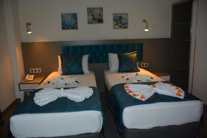 Posteľ alebo postele v izbe v ubytovaní THE NORDİC HOTEL