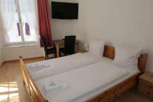 Voodi või voodid majutusasutuse Hotel Franziskaner toas