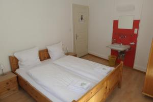 Voodi või voodid majutusasutuse Hotel Franziskaner toas