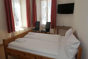 Voodi või voodid majutusasutuse Hotel Franziskaner toas
