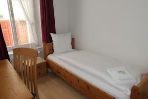 Voodi või voodid majutusasutuse Hotel Franziskaner toas