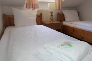 Voodi või voodid majutusasutuse Hotel Franziskaner toas
