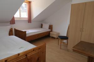 Voodi või voodid majutusasutuse Hotel Franziskaner toas