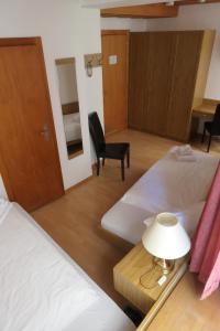 Voodi või voodid majutusasutuse Hotel Franziskaner toas