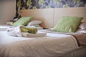 Postel nebo postele na pokoji v ubytování Hambledon Hotel