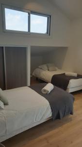 Postel nebo postele na pokoji v ubytování Appartement Laudon
