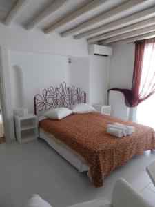 Postel nebo postele na pokoji v ubytování Mykonos Ornos RedOcher Home