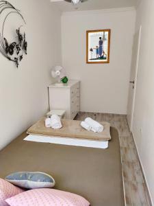 a room with two beds and a dresser in it at Appartements Dominique, with private terrace in Supetarska Draga +23 photos