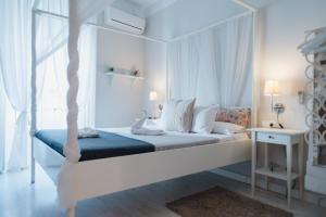 Łóżko lub łóżka w pokoju w obiekcie Hostal Vidamia
