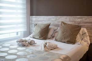 A bed or beds in a room at Hotel Ancora