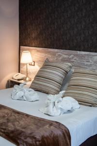 A bed or beds in a room at Hotel Ancora