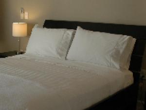 Postel nebo postele na pokoji v ubytování Haven Point Inn