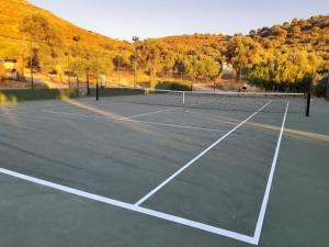 a tennis court with a tennis ball on it at Villa Radamanthis in Sívas