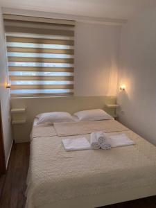 Postel nebo postele na pokoji v ubytování Apartments Boss