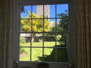 a window with a view of a yard at Instow Barton in Instow