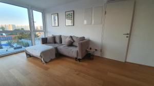 A seating area at Rooftop Terrace, free garage parking and Pool!