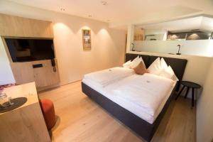 Voodi või voodid majutusasutuse Hotel Bradabella - Montafon toas