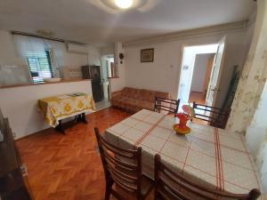 a living room with a table and a couch at Apartment Boris in Labin