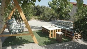 A garden outside Studio Panagiota - Oasis holiday houses