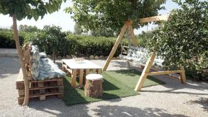 A garden outside Studio Panagiota - Oasis holiday houses