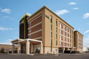 a large building with a sign on the front of it at Home2 Suites By Hilton Dayton/Beavercreek, Oh in Beavercreek