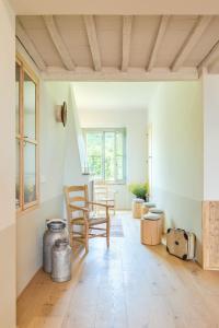 a living room with a chair and a table at CUGUSI BnB in Montepulciano