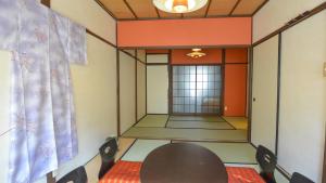 
a living room with a couch and a table at Kyougetsu-an in Kyoto

