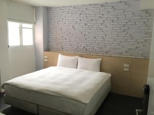 Postel nebo postele na pokoji v ubytování Taimali Hotel