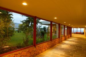 a building with large windows with a view of the ocean at Amalia Hotel Delphi in Delfoi