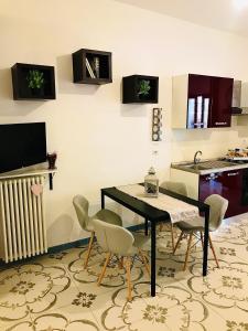 TV a/nebo společenská místnost v ubytování B&B Le Statuine